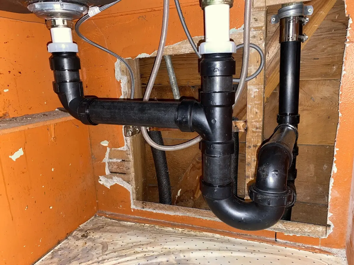 Professional Garbage Disposal Repair equipment and tools on the job in Northfield